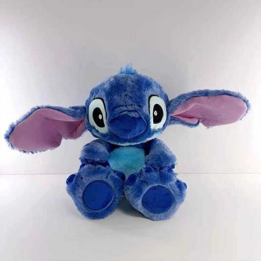 a pink and blue disney lilo and stitch breathing soothing plush toy showing the light-up belly and soft fabric texture