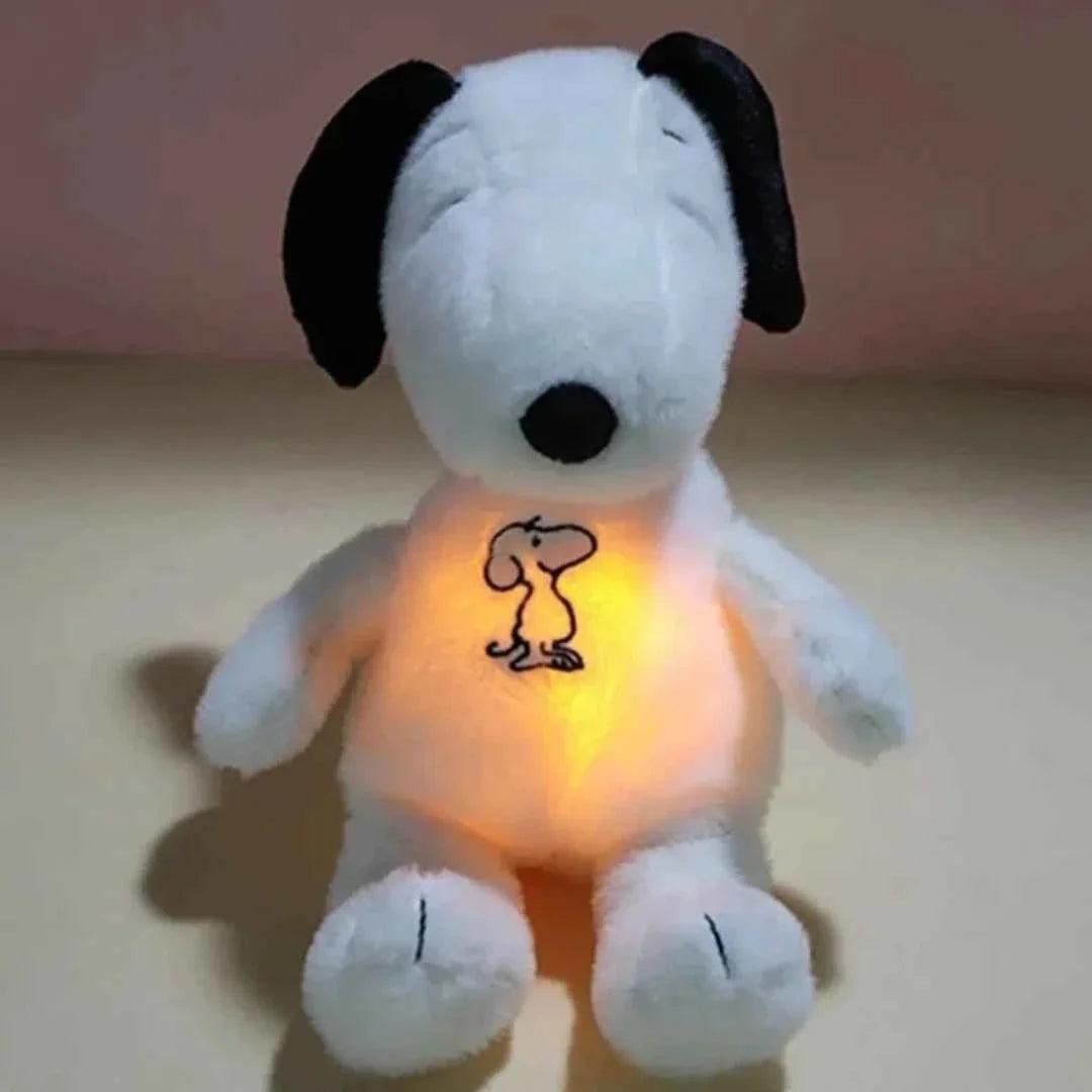 A soft white Snoopy plush toy with iconic black floppy ears and a red collar, sitting in a classic pose, perfect for Peanuts comic strip fans and collectors.