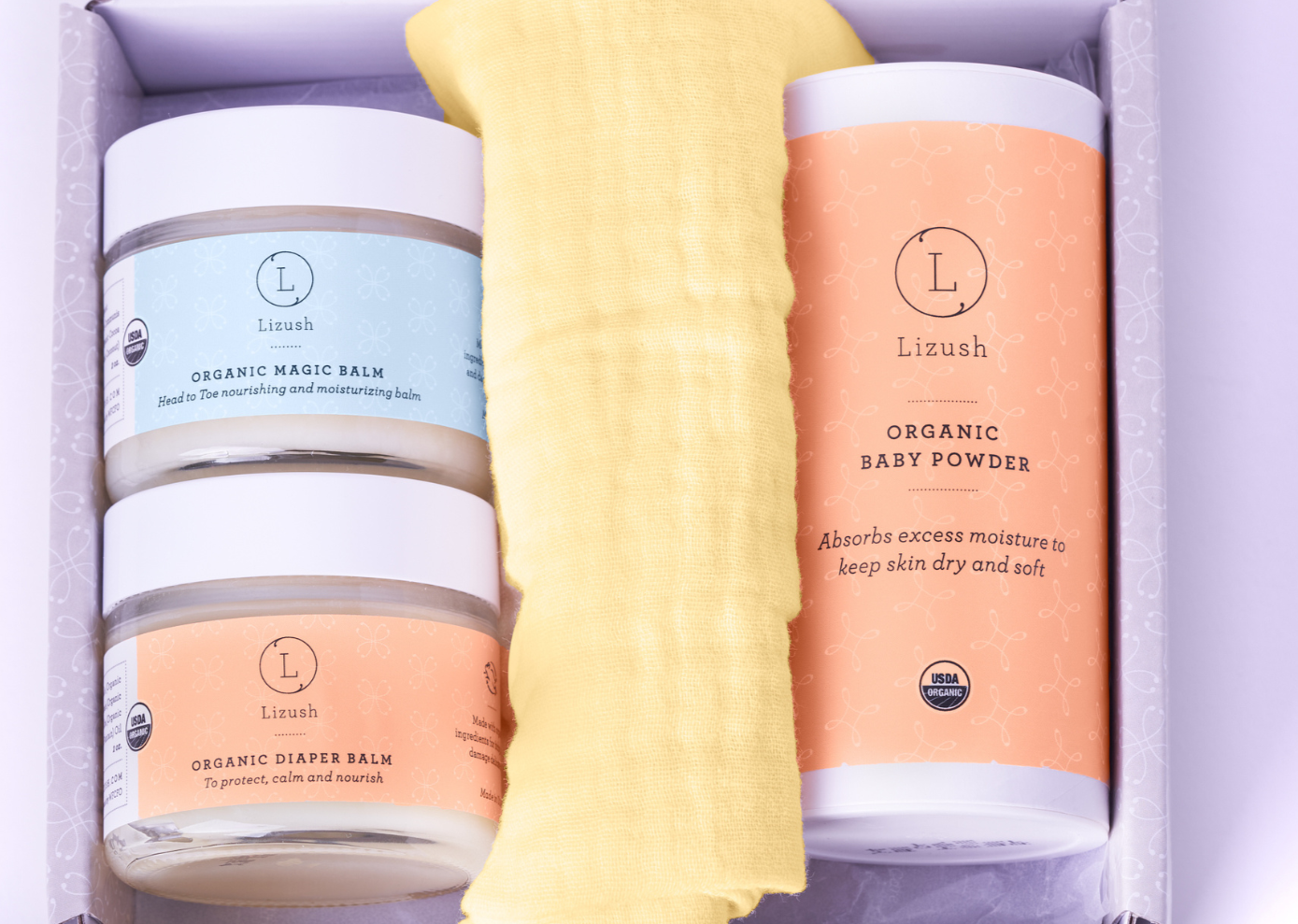 A premium luxury spa gift box featuring eucalyptus bath products, a ceramic mug, a small teddy bear, and a personalized lid with rose gold lettering.