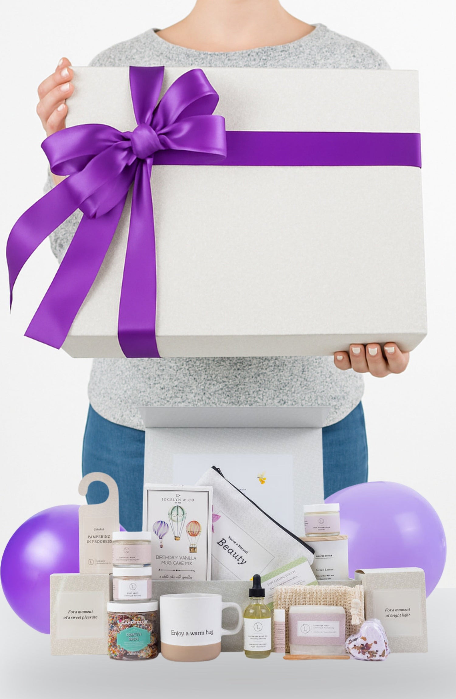 Premium Birthday Gift Basket for her featuring a ceramic mug, lavender spa products, scented candle, and personalized name on a gorgeous gift box lid.