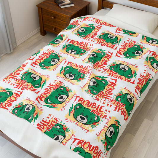 "Trouble Maker" Graphic Velveteen Plush Blanket – Soft White Throw with Green Bear & "Just Be Happy" Quote – Playful Decor 50" × 60"