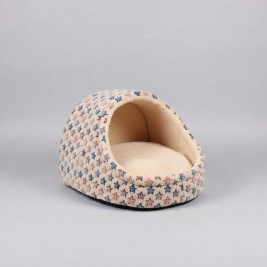 Pet bed with star pattern on a wooden floor