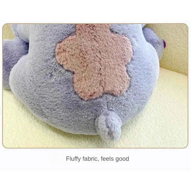 Purple Stitch plush toy with big ears and cute expression sitting upright