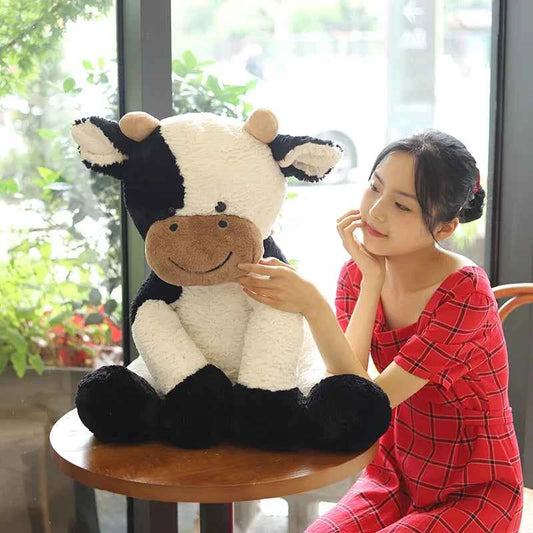 Kawaii Sitting Milk Cow Plush Toy – Lifelike Stuffed Cattle Doll (25–70cm)
