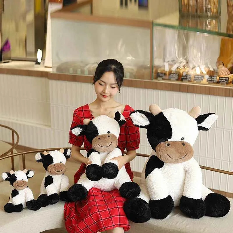 Kawaii Sitting Milk Cow Plush Toy – Lifelike Stuffed Cattle Doll (25–70cm)