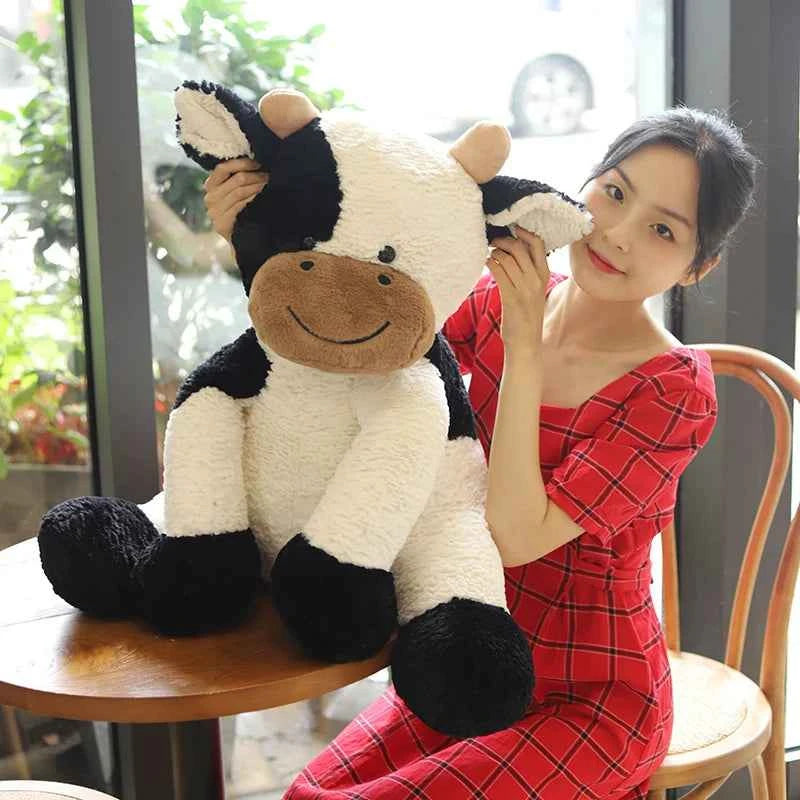 Kawaii Sitting Milk Cow Plush Toy – Lifelike Stuffed Cattle Doll (25–70cm)