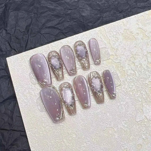 Set of 10 short naked cat eye press on false nails featuring a sparkling laser butterfly decoration on full cover plastic tips.